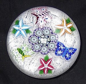 Flowers and butterflies on lace by John Deacons